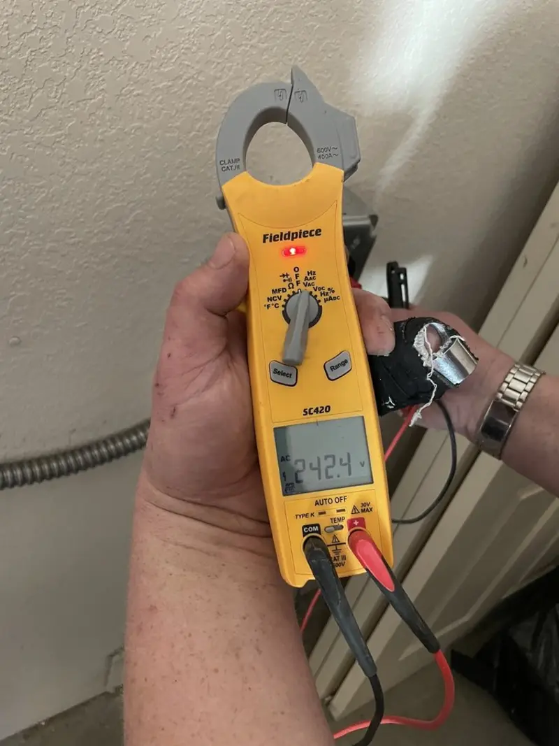 Voltage testing with clamp meter during Aluminum Wiring Replacement in Yoakum